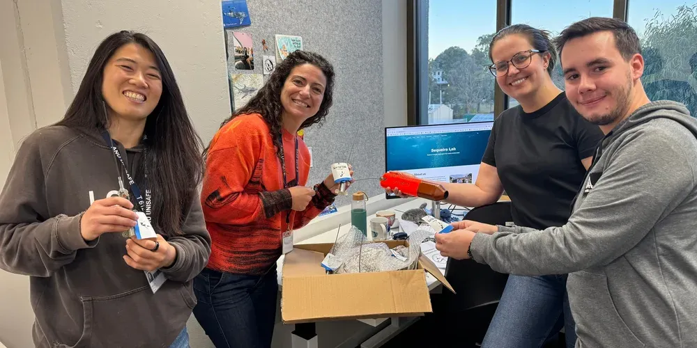 Lab members preparing tagging devices for fieldwork