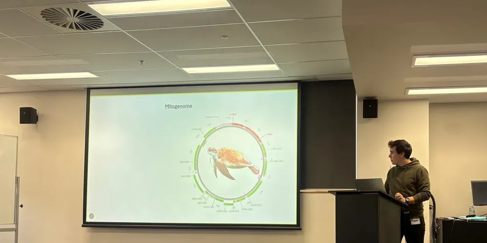 A student presenting turtle research at ANU